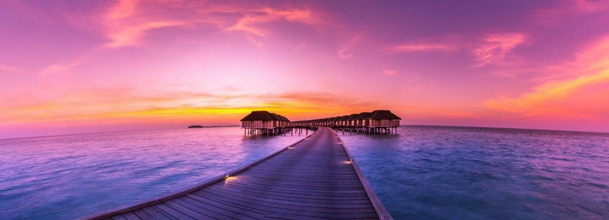 Maldives resort with turquoise water and overwater villas